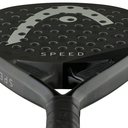 Close-up of the HEAD Speed Pro 2025 Padel Racket in black, showcasing "SPEED" on its surface. The racket features a perforated design with round holes and incorporates Auxetic 2.0 technology and Power Foam for enhanced performance with a sleek, modern look.