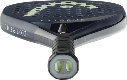 Close-up of the handle and lower part of the HEAD Extreme Pro 2025 Padel Racket - Blue, showing a hexagonal butt cap, diamond-shaped head, black and gray details, and “EXTREME” text on the frame.