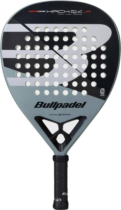 The Bullpadel HACK Junior 2026 Padel Racket by Bullpadel features a black and gray design with white accents, round perforations, and the Bullpadel logo below the string area, inspired by Paquito Navarro.