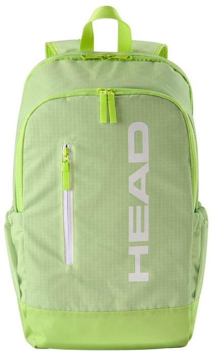 The HEAD BASE Padel Backpack 17L - SG in lime green has a modern design with a front pocket, vertical white zipper, and "HEAD" printed on the spacious main compartment. It includes a racket compartment, top handle, and adjustable shoulder straps for easy carrying.