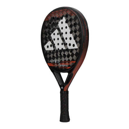 The ADIDAS Cross It CTRL Padel Racket - Black / Red by adidas features a striking black and red color scheme with a unique checkered pattern. It is equipped with the Spin Blade Mold technology to improve control and spin. The handle includes a sophisticated black grip accented by stylish red highlights, while the face prominently displays a sizable striped logo.