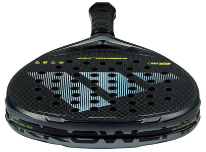 A close-up of the adidas Arrow Hit 2026 Padel Racket showcases its honeycomb pattern, large silver "D" logo, intelligent balance system for powerful play, black grip tape, and striking green text accents in a sleek design.