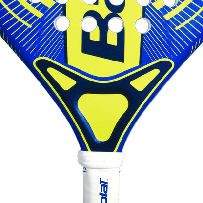 Close-up of the Babolat Alioth Mini Junior Padel Racket in blue and yellow, highlighting its perforated geometric design and part of the white handle featuring the Babolat logo.