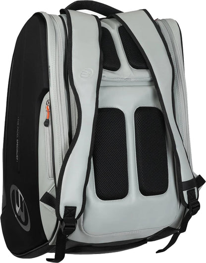 The Bullpadel BPP26013 Hack 2026 Padel Racket Bag - Grey is shown from the back, highlighting padded shoulder straps, a ventilated mesh panel, an orange-zippered side pocket, and thermal compartments to protect your rackets.