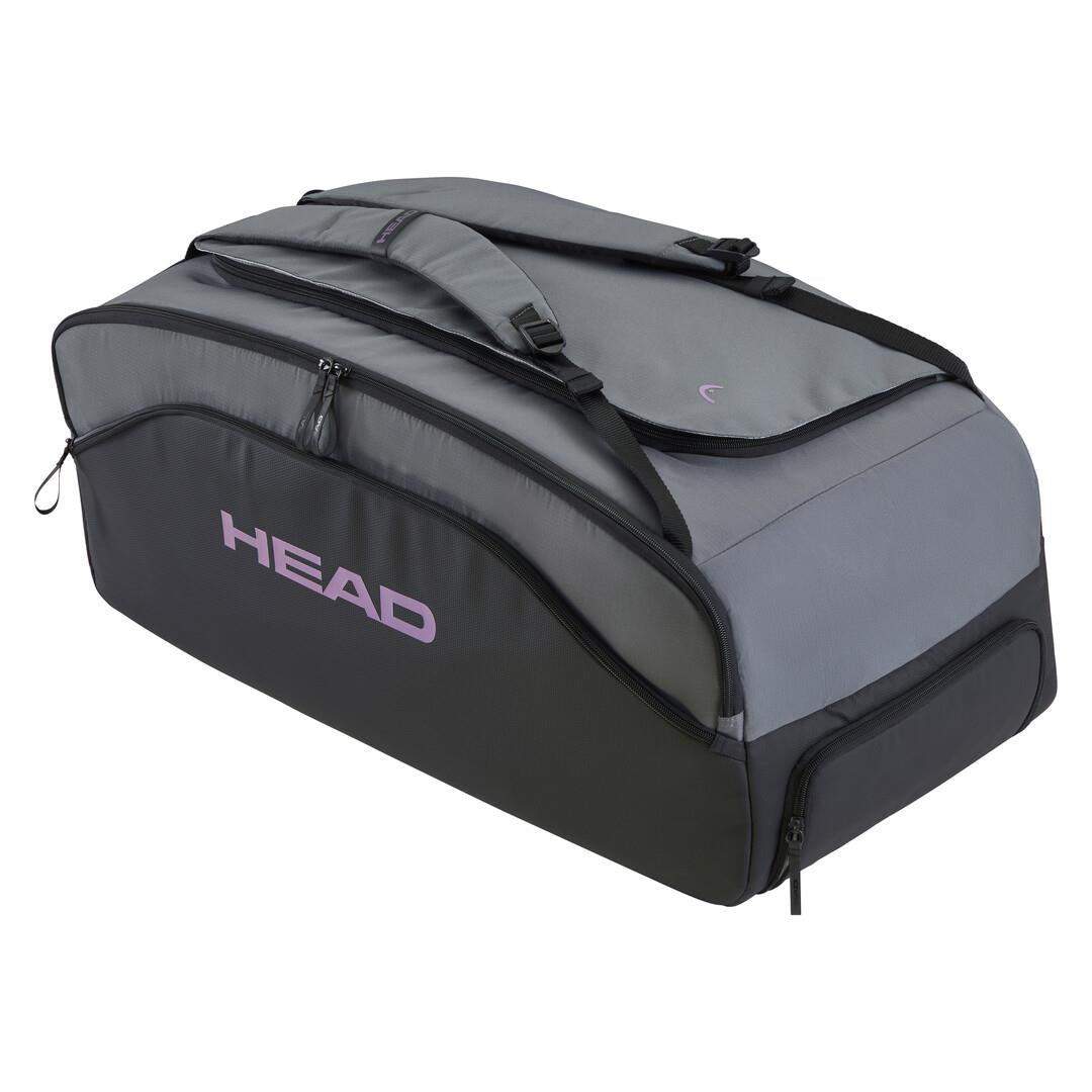 The HEAD Pro X Duffle Padel Bag L in black and dark grey features "HEAD" in purple on the side, CCT+ climate control, multiple compartments, adjustable straps, and is crafted from recycled PET bottles for sustainable athletic gear transport.