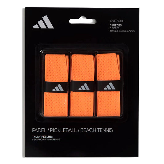 The adidas Padel Overgrips (3 Pack) in orange offer comfort and performance with micro-perforations. Suitable for padel, pickleball, or beach tennis; features adidas branding on sleek black-and-white packaging.