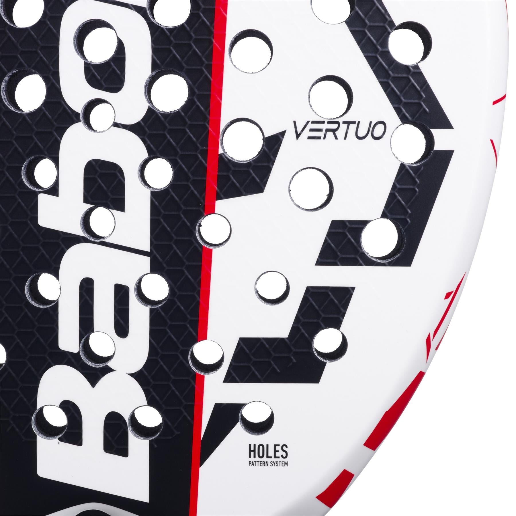 A close-up of the Babolat Technical Vertuo Juan Lebrón padel racket showcases its sleek white, black, and red design. The racket features the brand name "Babolat," "VERTUO," and multiple circular holes accented with red along the edge.