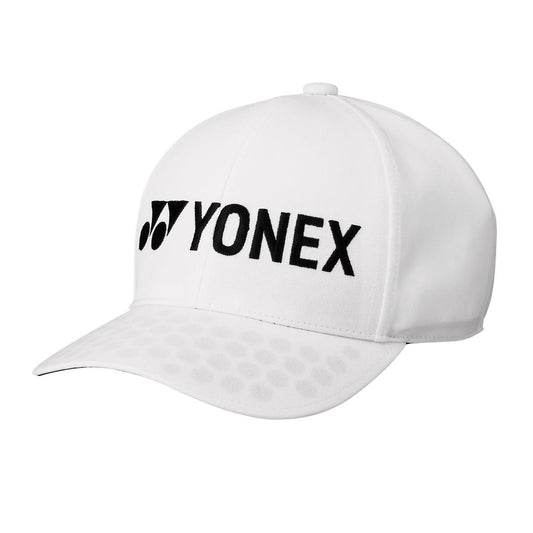 The Yonex 40063 Padel Cap in white is designed from sweat-wicking material and features a curved brim adorned with subtle circular patterns. The cap is both stylish and functional, displaying the Yonex logo and name in black text on the front, making it an ideal choice for any athlete.