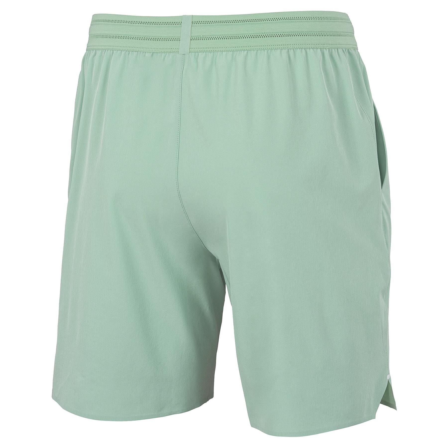 Tecnifibre Team Stretch Mens Padel Shorts in sage green are shown from the back, featuring an elastic waistband, subtle seam detail, and side pockets—ideal for on-court comfort.