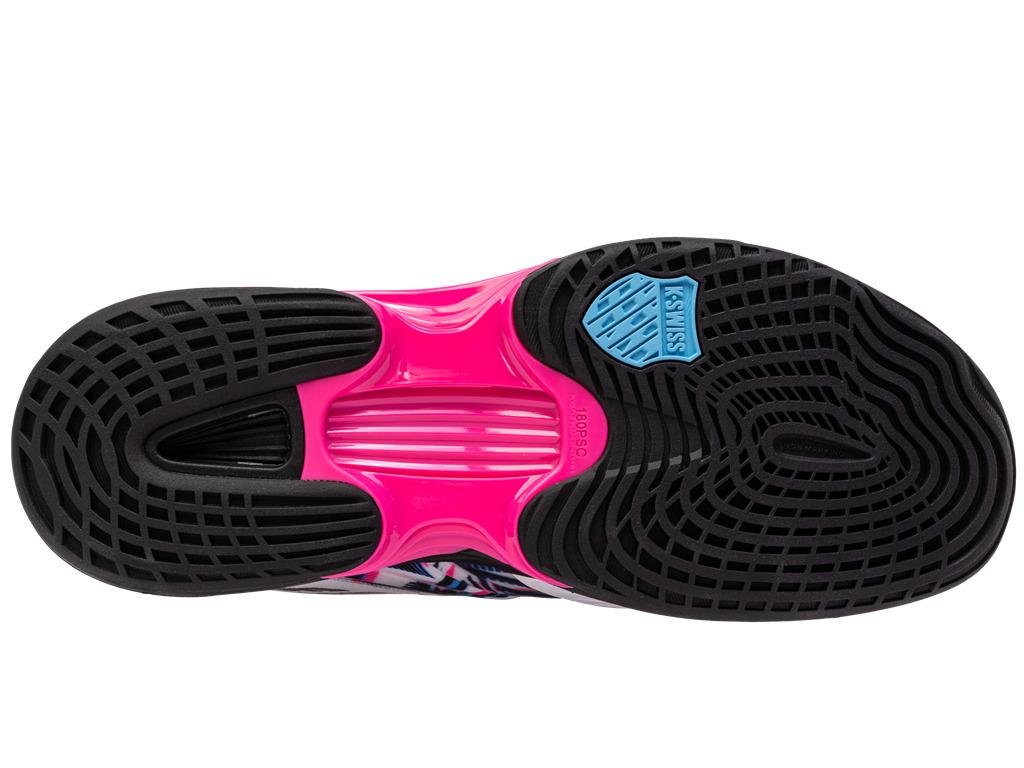 The image displays the sole of a K-Swiss Speedtrac Padel Shoe, featuring a vibrant neon pink section at its center, accentuated by black tread patterns with AÖSTA 7.0 technology. Near the heel area, the iconic blue K-Swiss logo is visible alongside Ortholite comfort technology for enhanced cushioning.