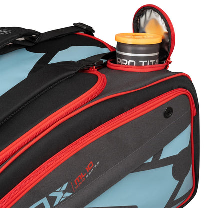 A close-up of the NOX ML10 Competition XL Compact Padel Racket Bag - Black / Red shows its black and red panels. A PRO TITAN can is partially visible in an open side pocket. Brand: NOX.