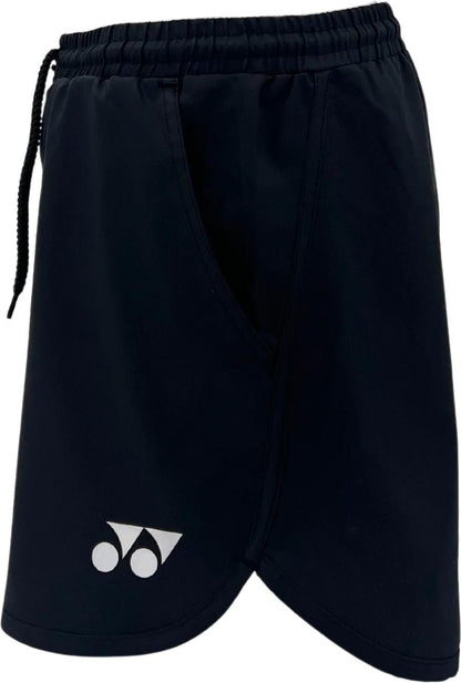 The Yonex YST2024 Womens Padel Shorts in black feature a white Yonex logo near the bottom left hem, breathable sports fabric, an elastic waistband with drawstring, and a visible side pocket.