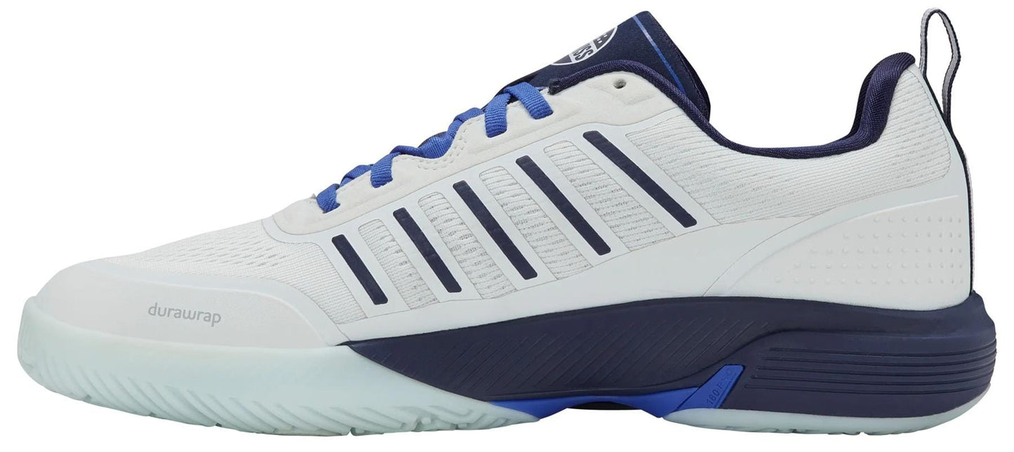 The K-Swiss Ultra Court Men's Padel Shoes in Bit Of Blue/Naval Academy/Dazzling Blue feature blue laces, a white textured sole, dark blue accents on the heel and logo, striped ventilation details, and "durawrap" for high performance.