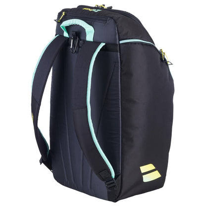 The Babolat RH Perf Padel 2nd Gen Backpack in Black/Multi features padded shoulder straps, yellow zipper pulls, and a small yellow logo on the lower side. The bag is shown from the back at an angle.