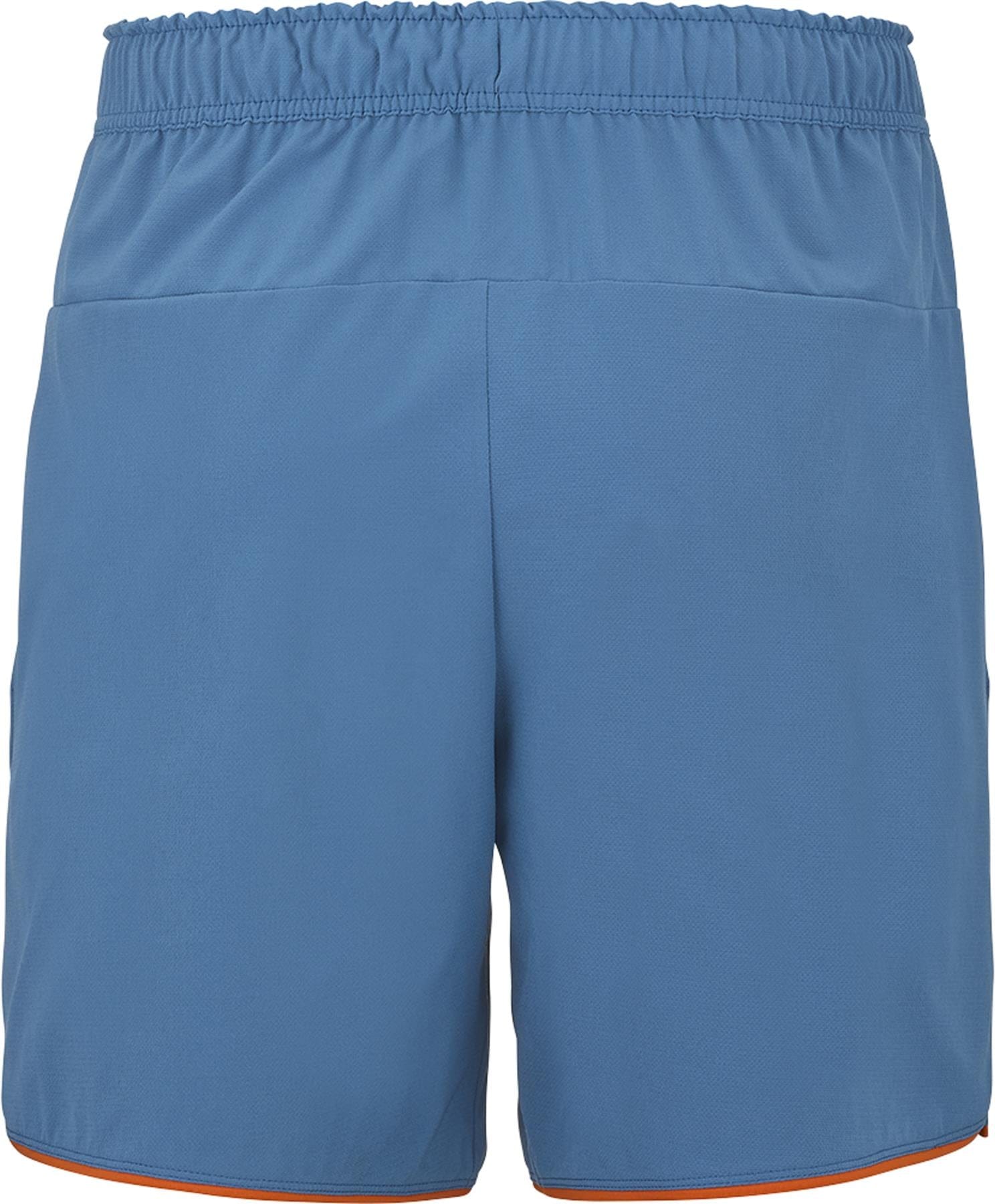 Babolat Perf Mens Padel Shorts - Seaport, by Babolat, feature a breathable blue design with an elastic waistband, slight orange trim at the leg openings, no visible logos or patterns, and are shown from the back.