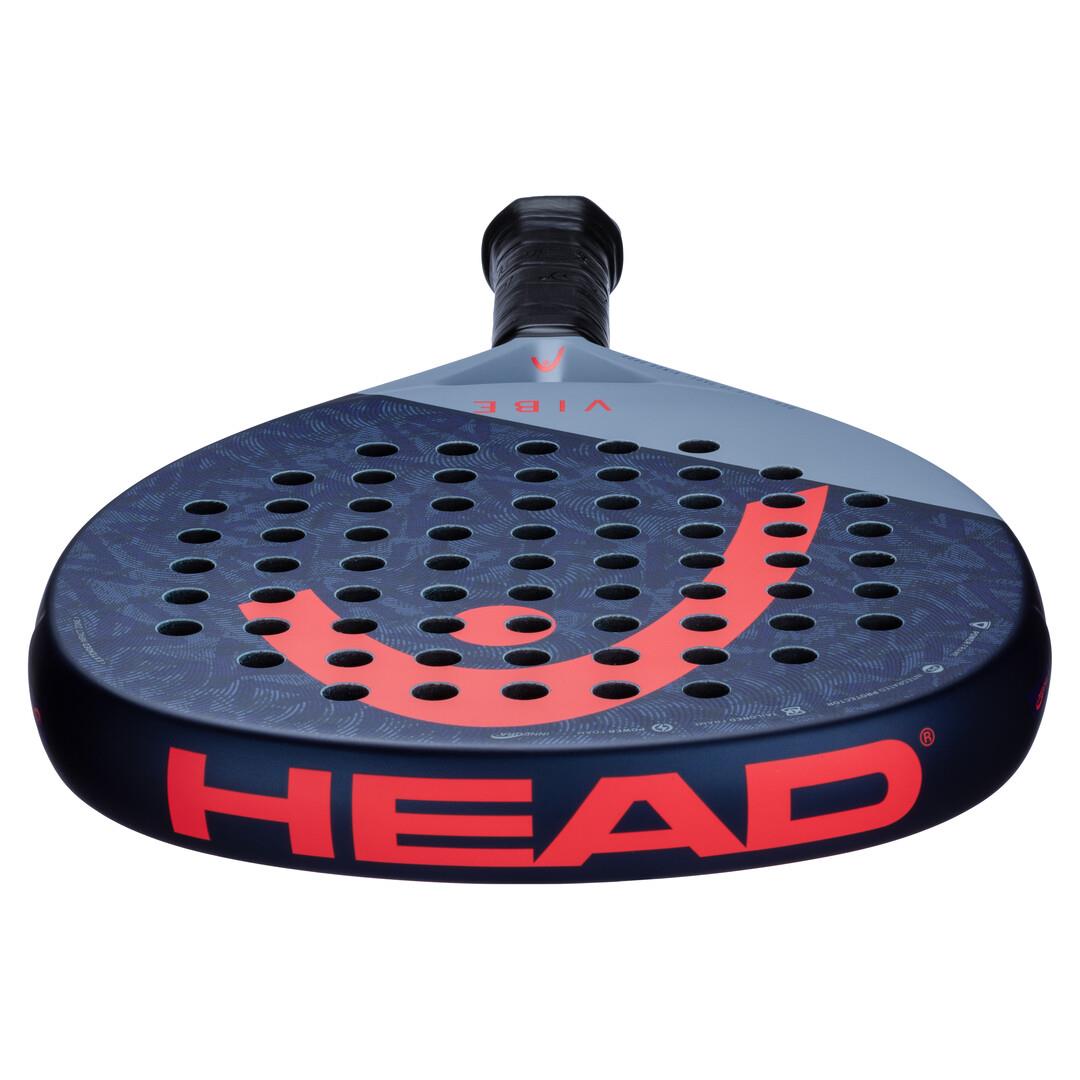 The HEAD Vibe 2025 Padel Racket showcases a blue and red round head with an orange logo and perforations. The brand "HEAD" is prominently displayed on the lower edge, providing easy power through its Power Foam technology.