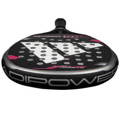 Close-up view of the adidas Adipower Carbon Light 3.4 Padel Racket in silver and pink, featuring "ADIPOWER" on the side, enhanced by Carbon 3K Fibre and 3D Spin Blade Mold, with circular holes throughout.