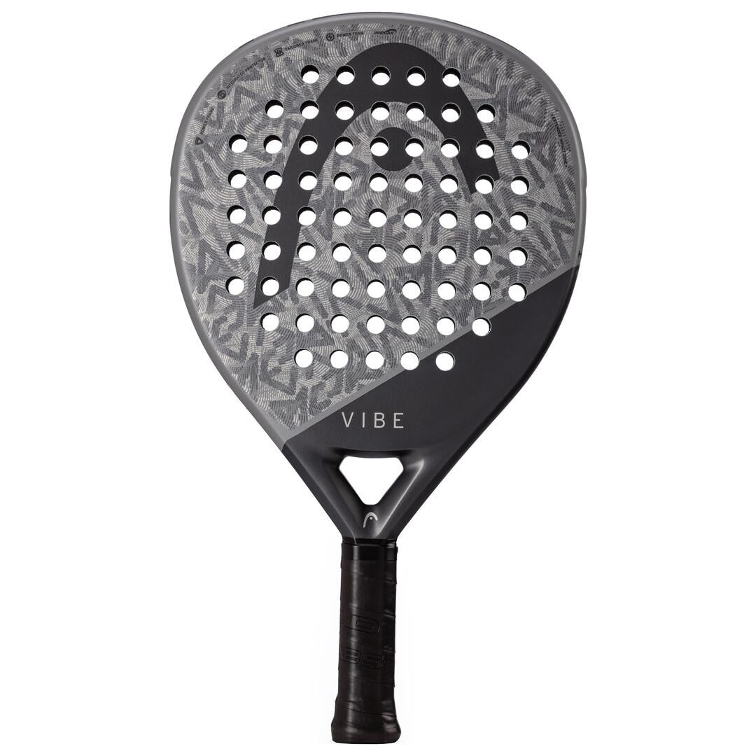 The HEAD Vibe 2025 Padel Racket features a stylish grey and black design. It has a patterned fiberglass surface with holes on the upper part, while the lower section is solid black. With an oversized teardrop frame, "VIBE" is printed near the handle, ensuring both style and performance.