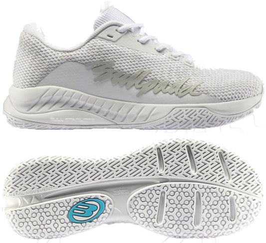 The Bullpadel Ionic W 26V Womens Padel Shoes in white offer a stylish mesh upper with “Bullpadel” in silver on the side and a blue-logo outsole—ideal for women seeking grip and performance on the padel court.
