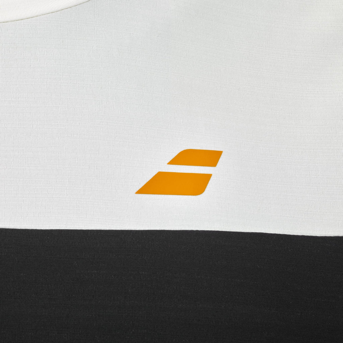 Close-up of the Babolat Crew Neck Mens Padel T-Shirt in black, crafted from technical fabric and featuring a small yellow geometric Babolat logo with two slanted rectangles stacked diagonally.