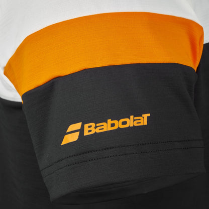 Close-up of the Babolat Crew Neck Mens Padel T-Shirt - Black sleeve, showcasing a color block design in black, orange, and white with the “Babolat” logo printed in orange on the black section. Made from technical fabric by Babolat, this t-shirt ensures comfort and performance on the court.