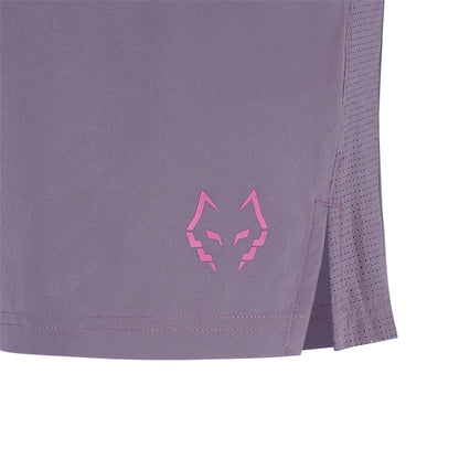 Close-up of the lower side of Babolat Juan Lebron Mens Padel Shorts - Black Plum showing a pink geometric wolf head logo, side slit with perforations, and lightweight stretch fabric.