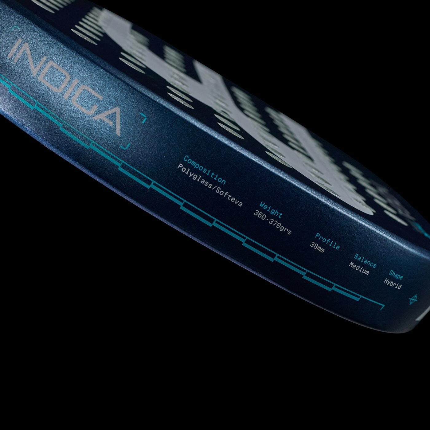 Close-up of the Bullpadel Indiga Pwr 2026 Padel Racket edge, featuring "INDIGA" and specs for composition, weight, profile, balance, and shape in light blue text on a dark background. Brand: Bullpadel.