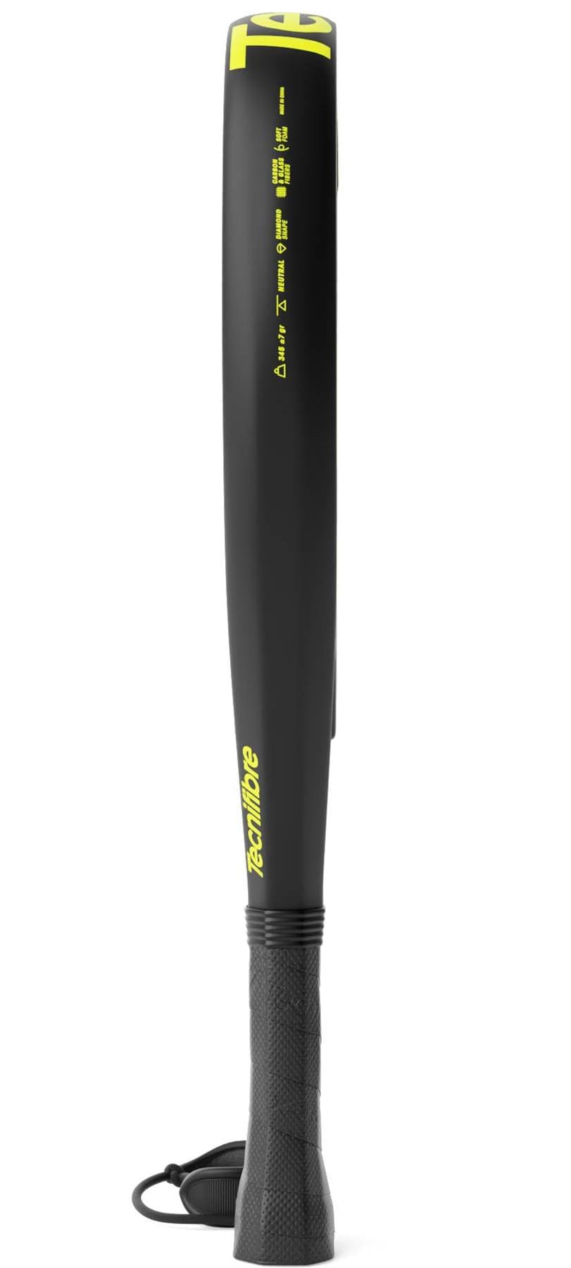 The Tecnifibre Bomba Lite Padel Racket by Tecnifibre stands upright on its handle, photographed from the side to show only the slim black and yellow fibreglass edge and grip.