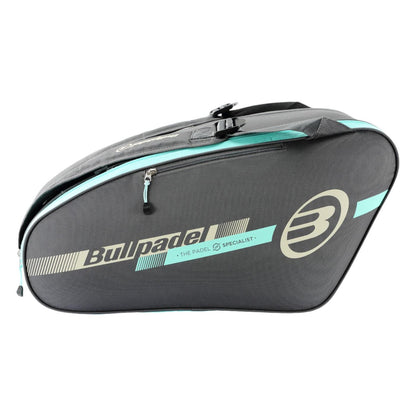 The Bullpadel Tour 25 Padel Racket Bag in grey features a zippered main section and a padded racket compartment. It prominently displays the logo with "THE PADEL SPECIALIST," making it ideal for padel enthusiasts.