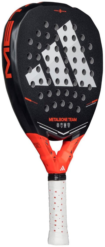 The ADIDAS Metalbone Team 2026 Padel Racket in black and red by adidas features a white grip, Spin Blade Gritt for control, large logo, "METALBONE TEAM" text, round holes, and a modern look—ideal for advanced players.