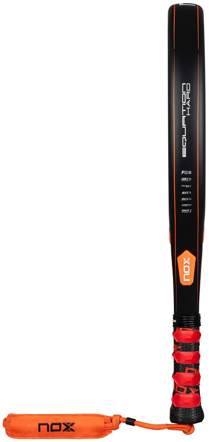 The NOX Equation Hard Advanced 2026 Padel Racket features a black and orange design, "NOX" on the grip, an orange wrist strap, and "Equation Hard" on the face. It includes an anti-vibration system for enhanced comfort.