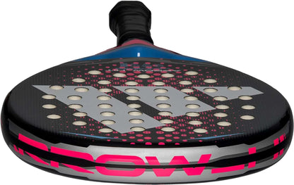 Close-up of the adidas ADIDAS Arrow Hit Junior White / Pink Padel Racket, featuring a black surface with large white dots, bold pink and silver geometric patterns, and a black handle.