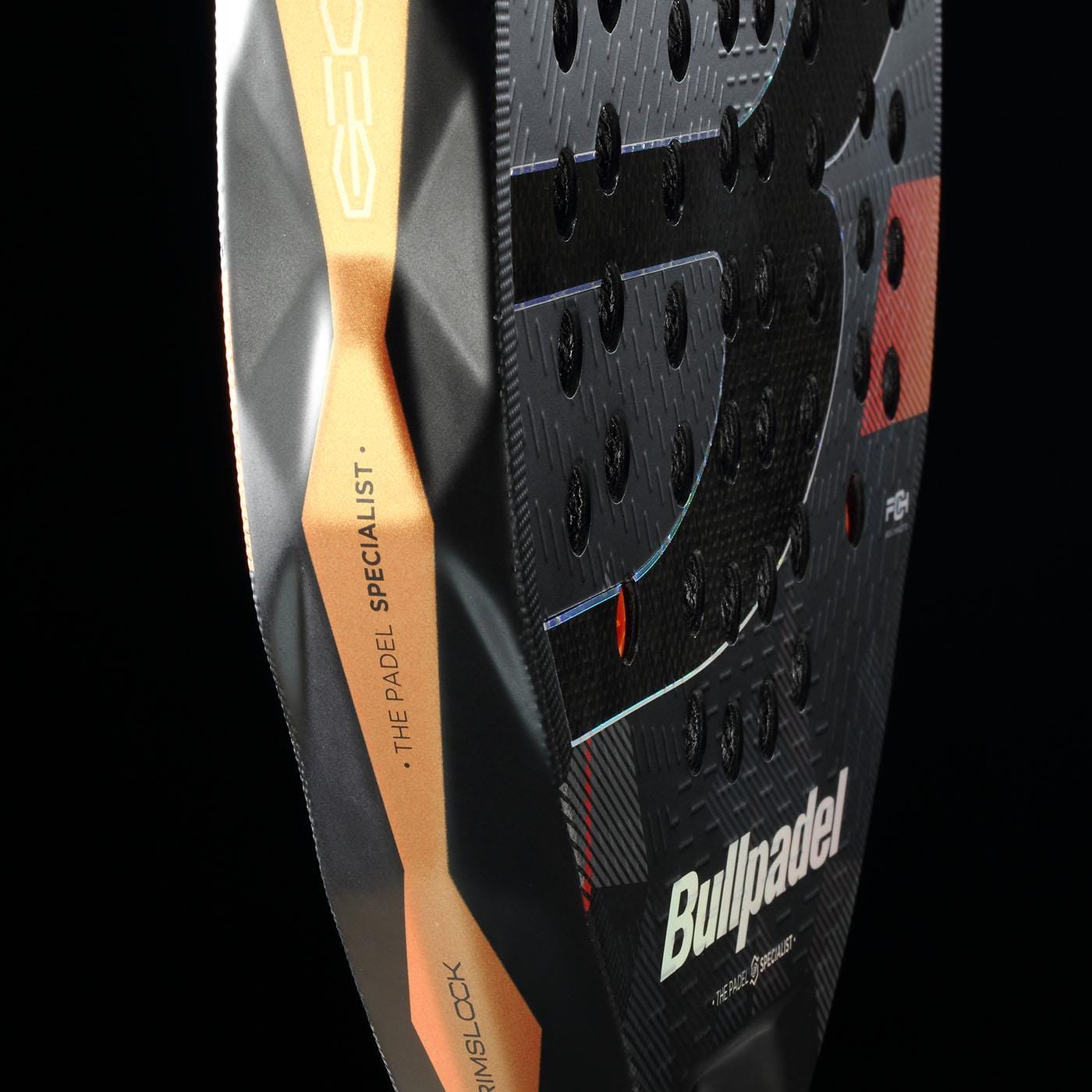 Close-up of the Bullpadel Neuron 02 Edge 2026 Padel Racket in black/red, showcasing PrismLock technology and "THE PADEL SPECIALIST" with the Bullpadel logo on its side and face against a black background.