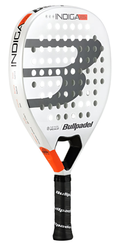 The Bullpadel Indiga Pwr 2025 Padel Racket features a white diamond-shaped head with a large grey "B," red edge accents, and extensive perforations. The "Bullpadel" branding is prominently displayed on both the handle and the face.