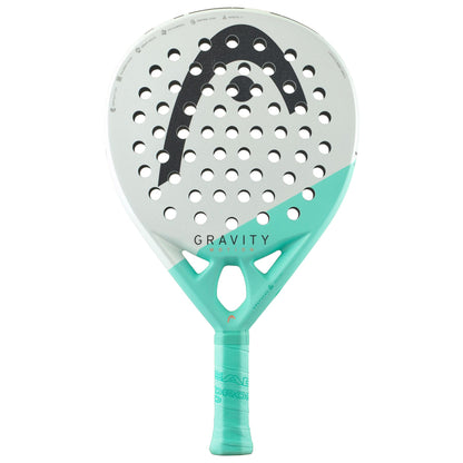 The HEAD Gravity Motion 2024 Padel Racket - Mint features a perforated design and a logo at the top, incorporating Spin Surface technology for enhanced performance. Its primarily white face is accented with turquoise at the bottom, and the grip is wrapped in matching turquoise material. It also displays the text "GRAVITY" and "MOTION".