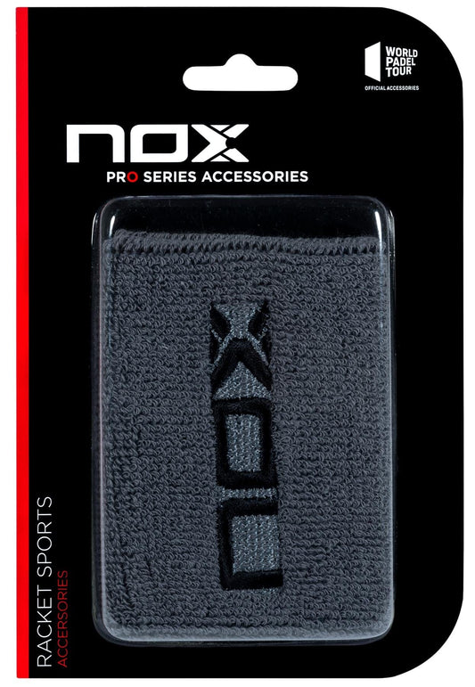 A black package contains the NOX Padel Wristband - Grey / Black, featuring the "NOX" logo in black and Balance Fresh technology for protection. Labeled as "NOX Pro Series Accessories" and "Racket Sports Accessories.
