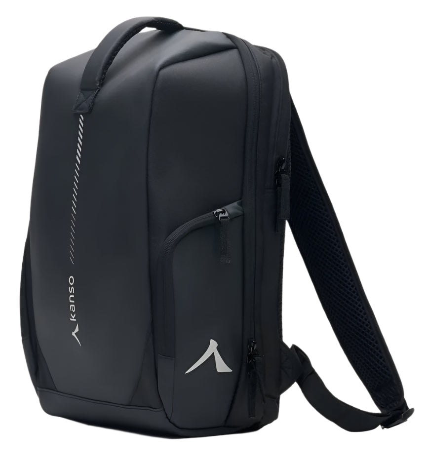 The Kanso Intuko Badminton 23L Backpack is your daily ally, featuring a sleek black design with "kanso" in white on the side. It includes multiple zippered compartments, a padded handle, and a subtle diagonal stripe accentuating its minimalist white logo.