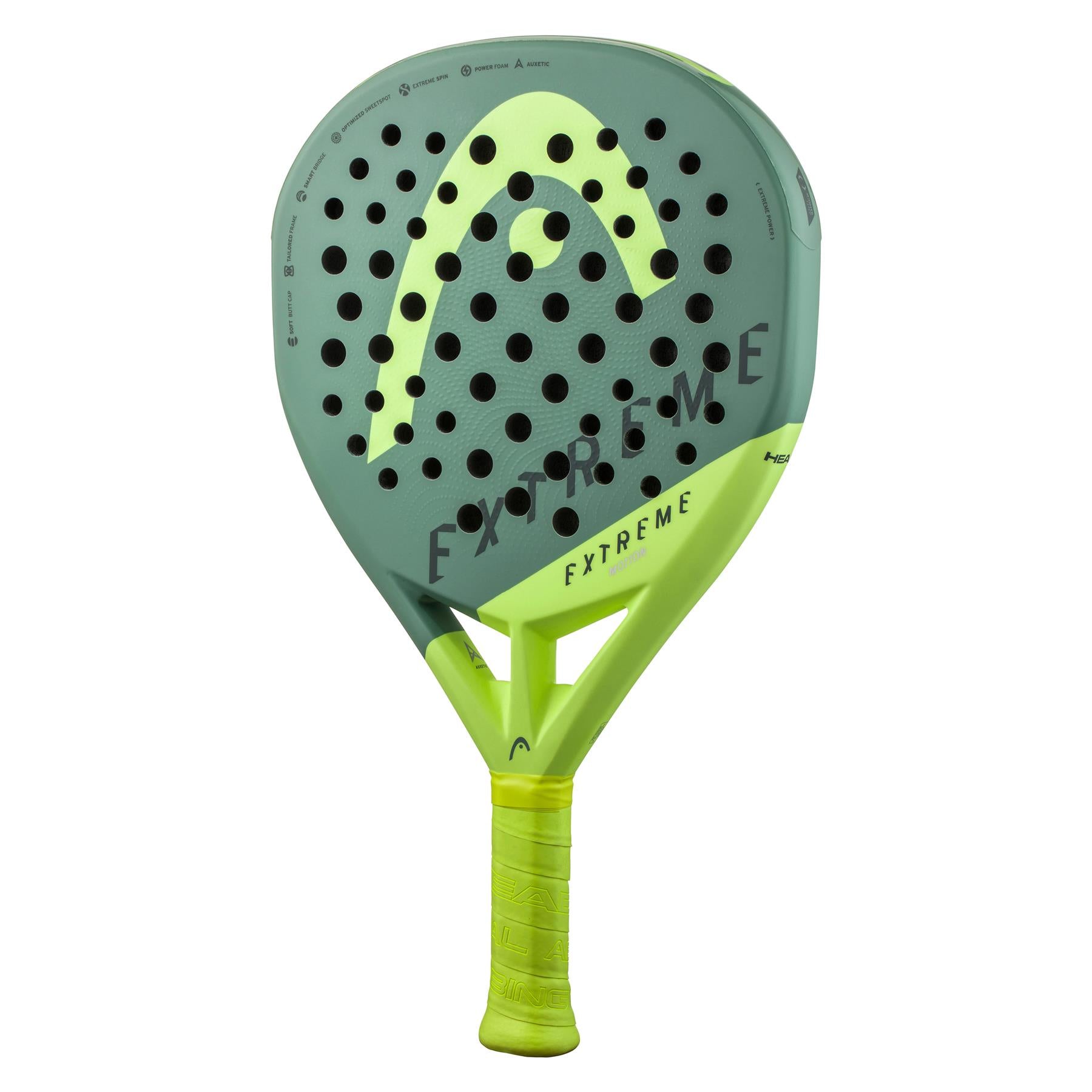 The HEAD Extreme Elite 2023 Padel Racket in green, by HEAD, features a textured grip handle and numerous small circular holes. It includes innovative Power Foam technology designed to enhance performance and comfort, offering an ideal balance of power and precision on the court.