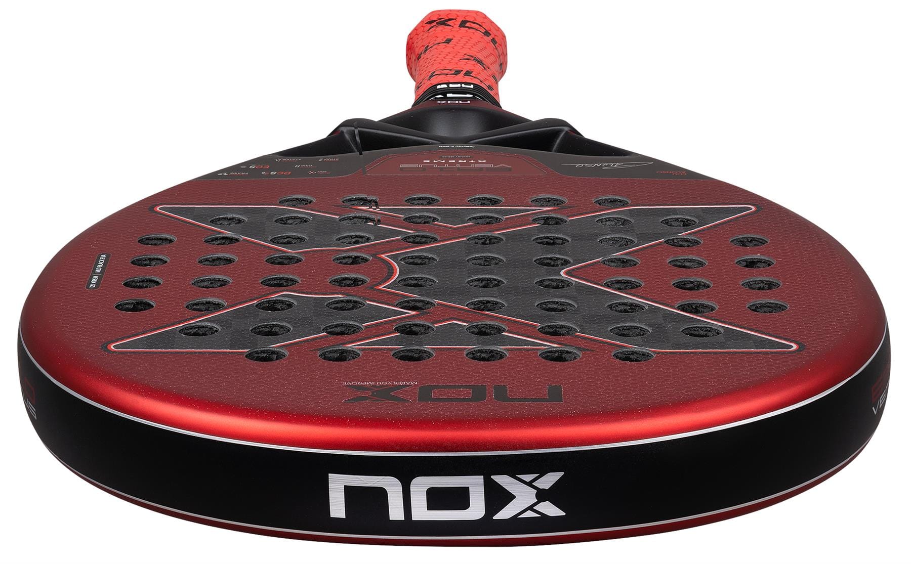 A close-up of the NOX Luxury EA10 Ventus Hybrid 12K XTREM By Edu Alonso 2026 padel racket shows its perforated surface with a bold carbon “X” design and NOX logos on the rim and handle, finished with a striking red grip.