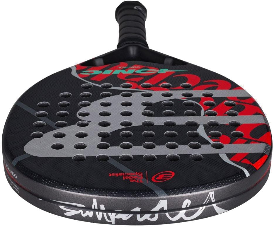A close-up of the Bullpadel Ionic Control 2026 Padel Racket, showcasing its red and silver graphics, precision circular holes, and a textured grip handle for enhanced control.