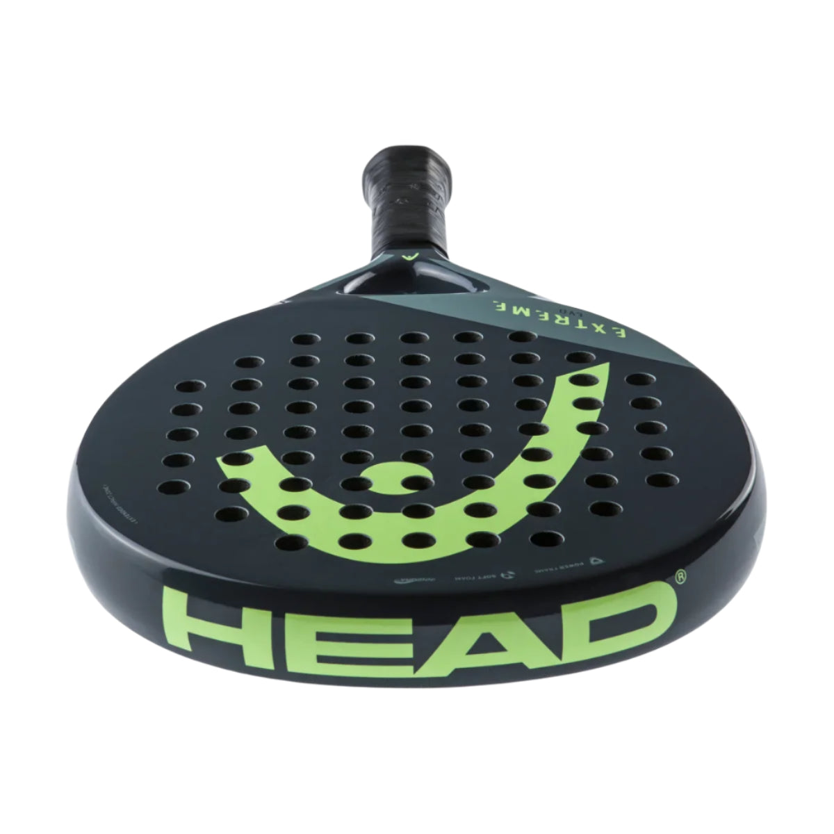 The HEAD Evo Extreme 2023 Padel Racket in black/green has a perforated surface with vibrant green accents. "HEAD" is boldly printed on the frame, with "EXTREME" on the throat, highlighting its advanced Innegra technology for improved performance.