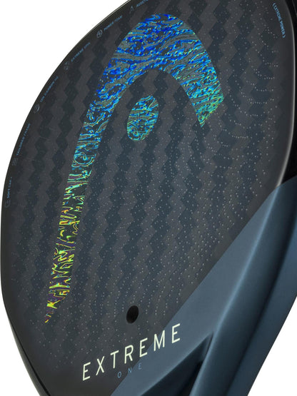 Close-up of the HEAD Extreme One 2025 Padel Racket by HEAD, showcasing its black and blue paddle, 12K Carbon Fibre build, holographic logo, and "EXTREME ONE" print near the bottom.
