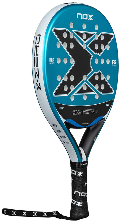 The NOX X-Zero Blue Padel Racket by NOX features a large X design, blue and black color scheme, circular perforations for control, and a NOX-branded grip—ideal as a beginner padel racket.