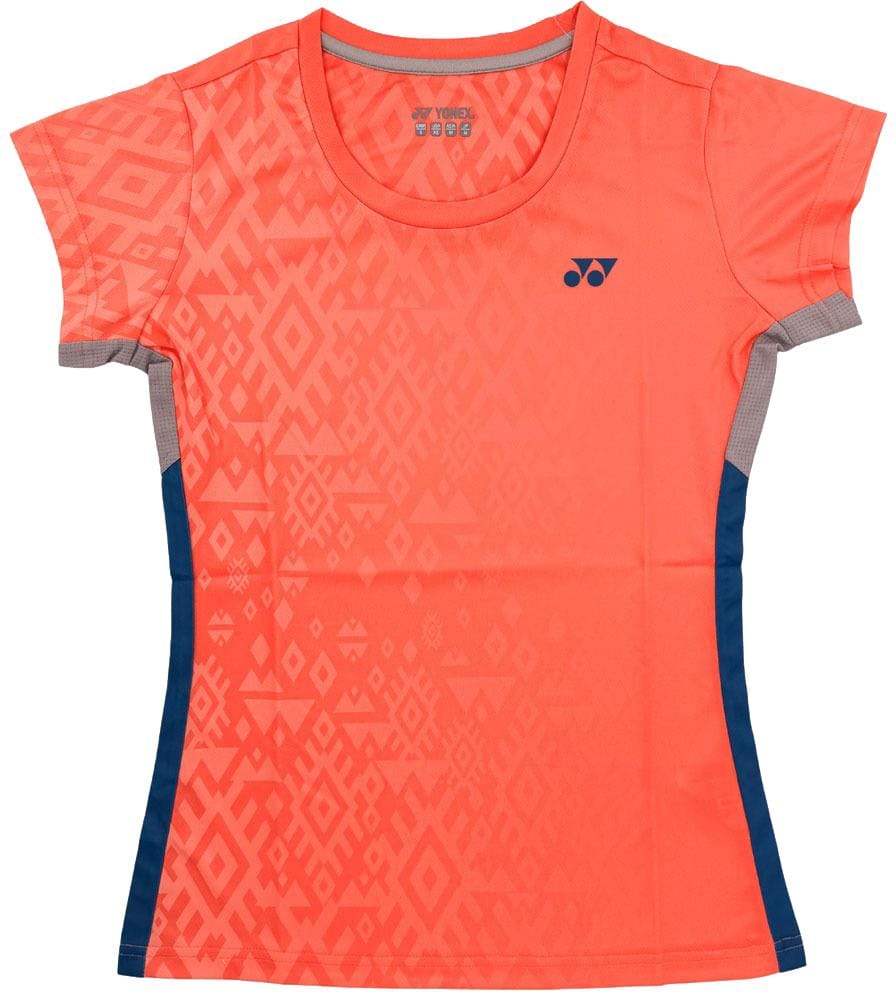 The Yonex YTL11 Womens Padel T-Shirt - Sunset features a bright coral hue, geometric pattern, navy side panels, chest logo, round neckline, and fitted design in quick-drying performance fabric.
