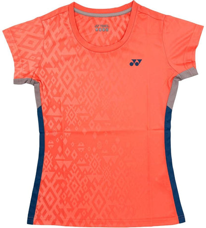The Yonex YTL11 Womens Padel T-Shirt - Sunset features a bright coral hue, geometric pattern, navy side panels, chest logo, round neckline, and fitted design in quick-drying performance fabric.
