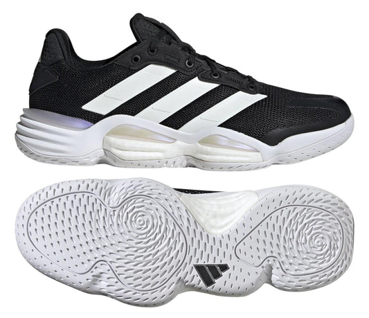 The ADIDAS Stabil 16 Men's Padel Shoes feature a sleek black design with bold white stripes on the sides. Equipped with a BOOST midsole for cushioning, they have a white sole with circular grooves for traction and boast a modern, streamlined silhouette.