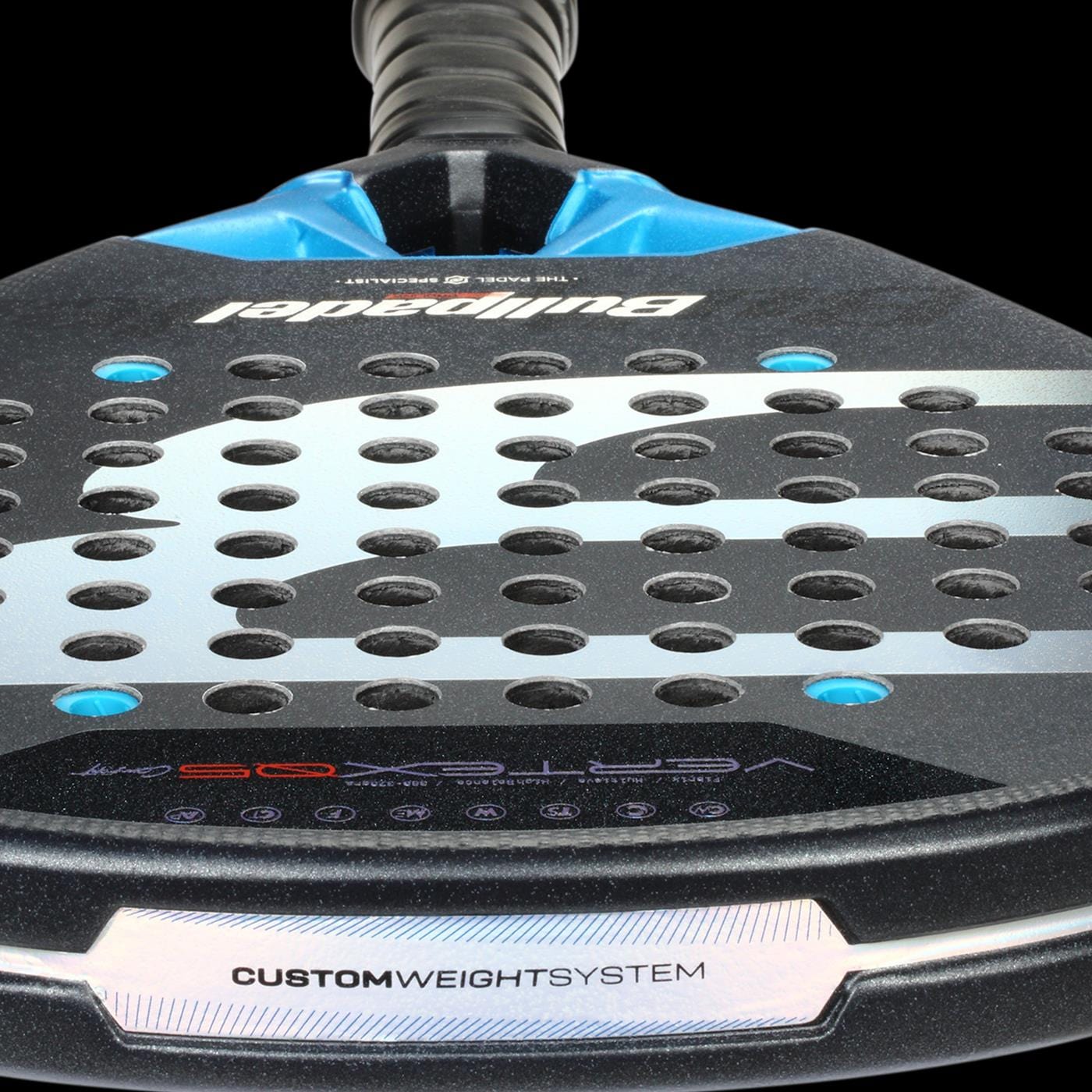 Close-up of the Bullpadel Vertex 05 Comfort 2026 Padel Racket by Bullpadel, featuring "CUSTOM WEIGHT SYSTEM" on its Fibrix fibre surface, circular holes, and a black-and-blue textured design.