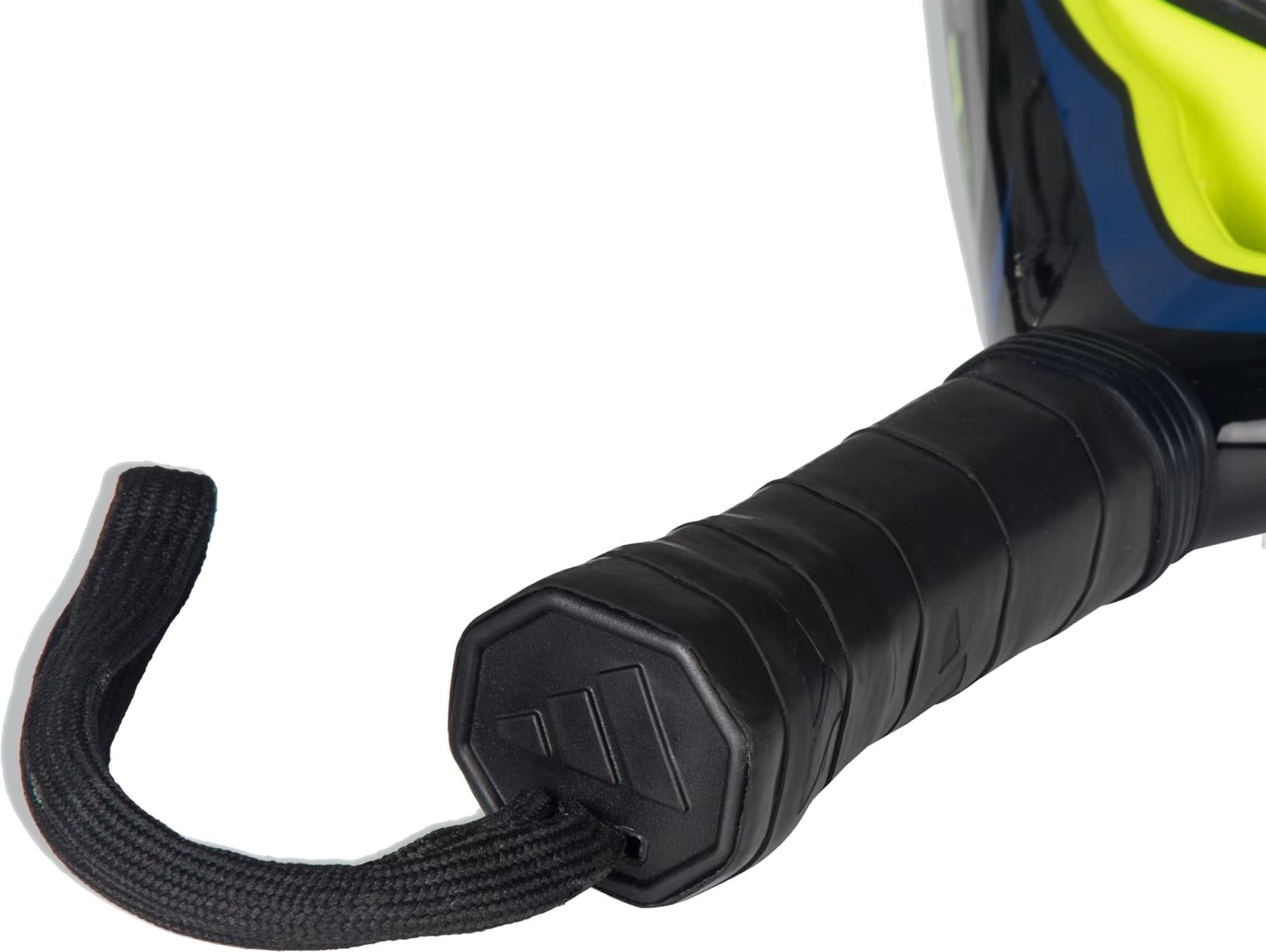 Close-up of the handle of an adidas Arrow Hit Junior White / Blue Padel Racket, wrapped in black grip tape with a wrist strap. The edge of this lightweight junior racket’s colorful frame is visible in the background.