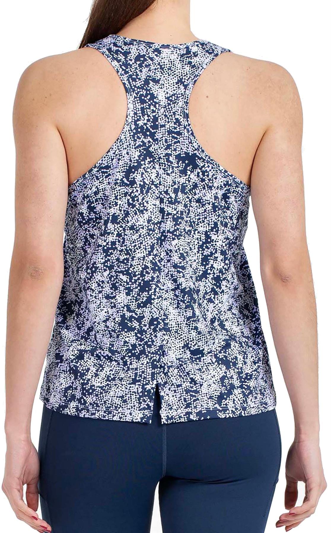 A person is shown from the back wearing the Bullpadel Pilme Women's Padel Tank Top in Deep Ocean with a blue and white pattern, paired with navy leggings. The racerback tank features a split hem for breathability. Background is plain white.