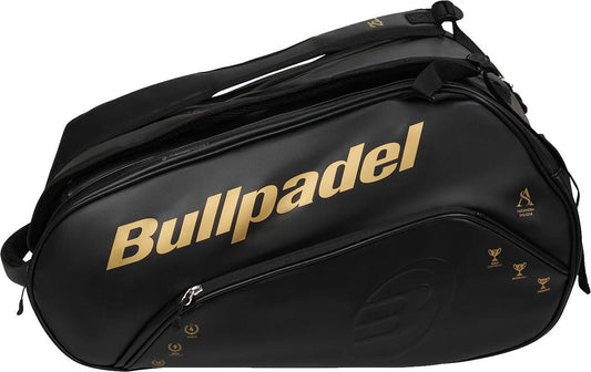 The Bullpadel BPP26006 Flow 2026 Padel Racket Bag in black features gold accents, thermal racket compartments, several zippered sections, and sturdy handles.